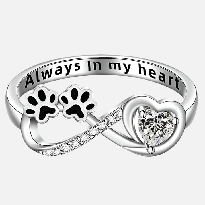 Ring with paw-shaped zirconia, heart and infinity symbol